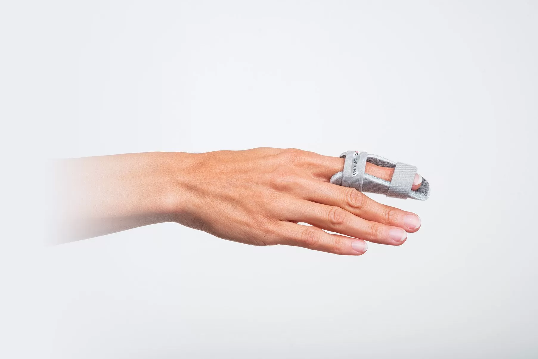 Angled view of a DIP and PIP splint secured with two straps