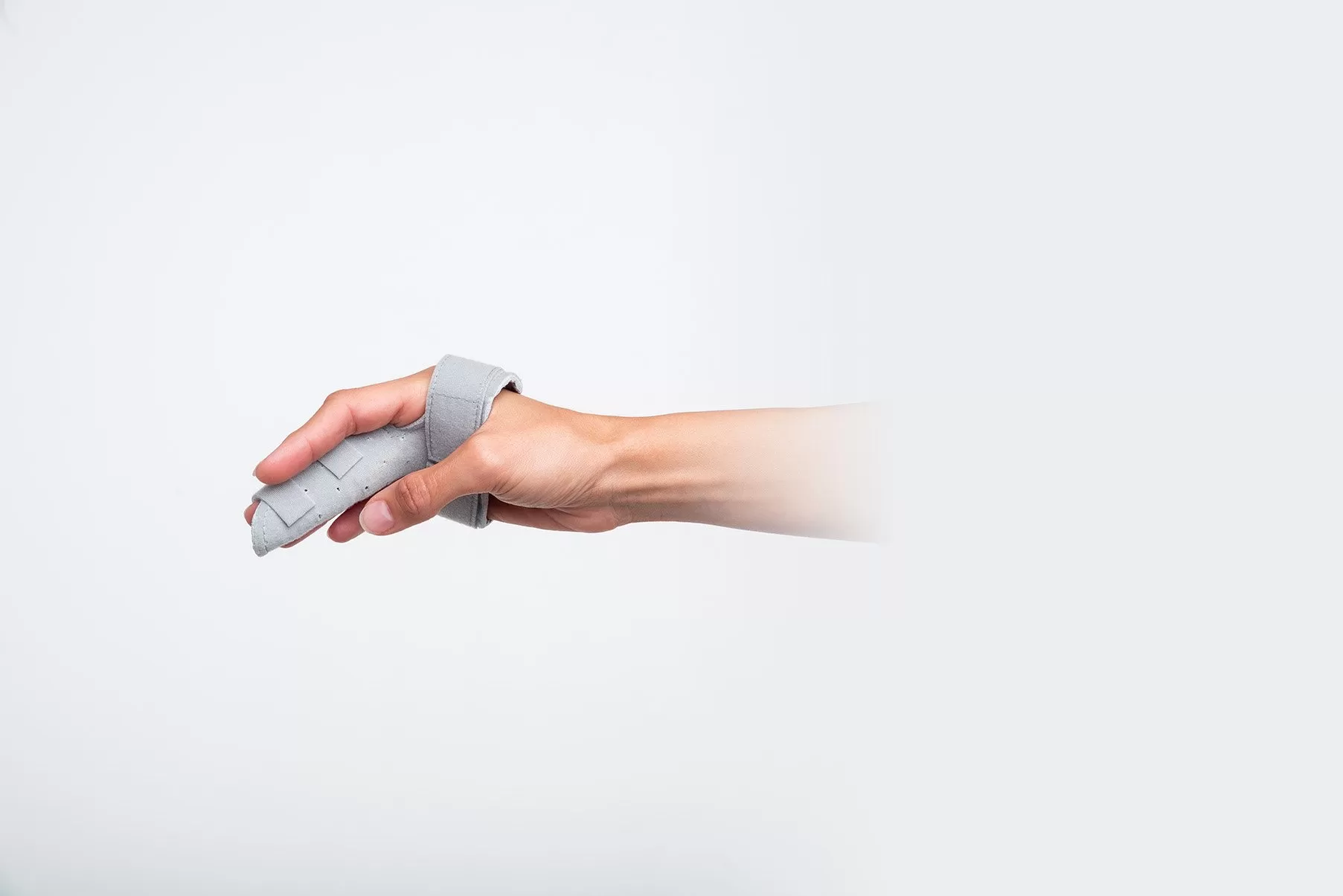 Side view of a Chrisofix MP joint orthosis fitted to the hand