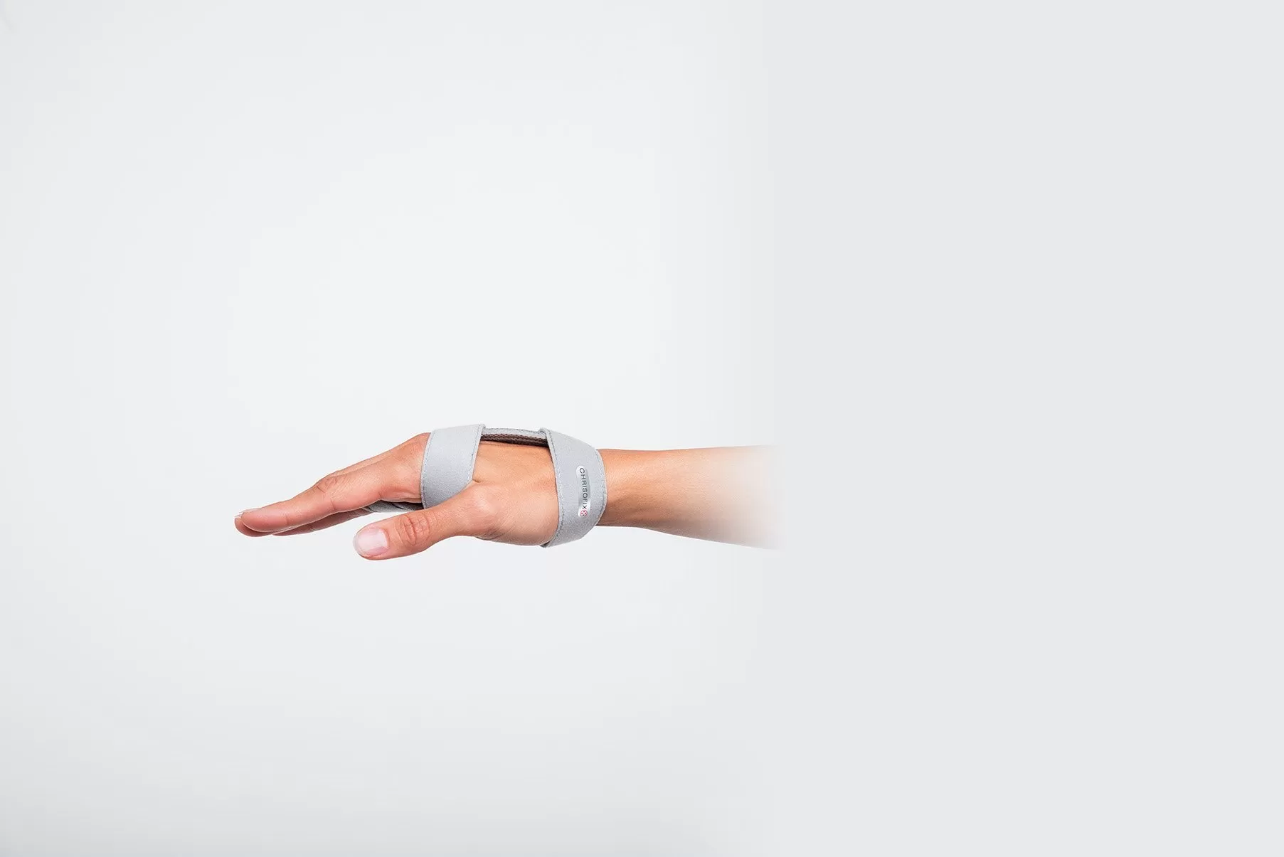 Dorsal view of a fifth metacarpal orthosis with wrist and finger straps